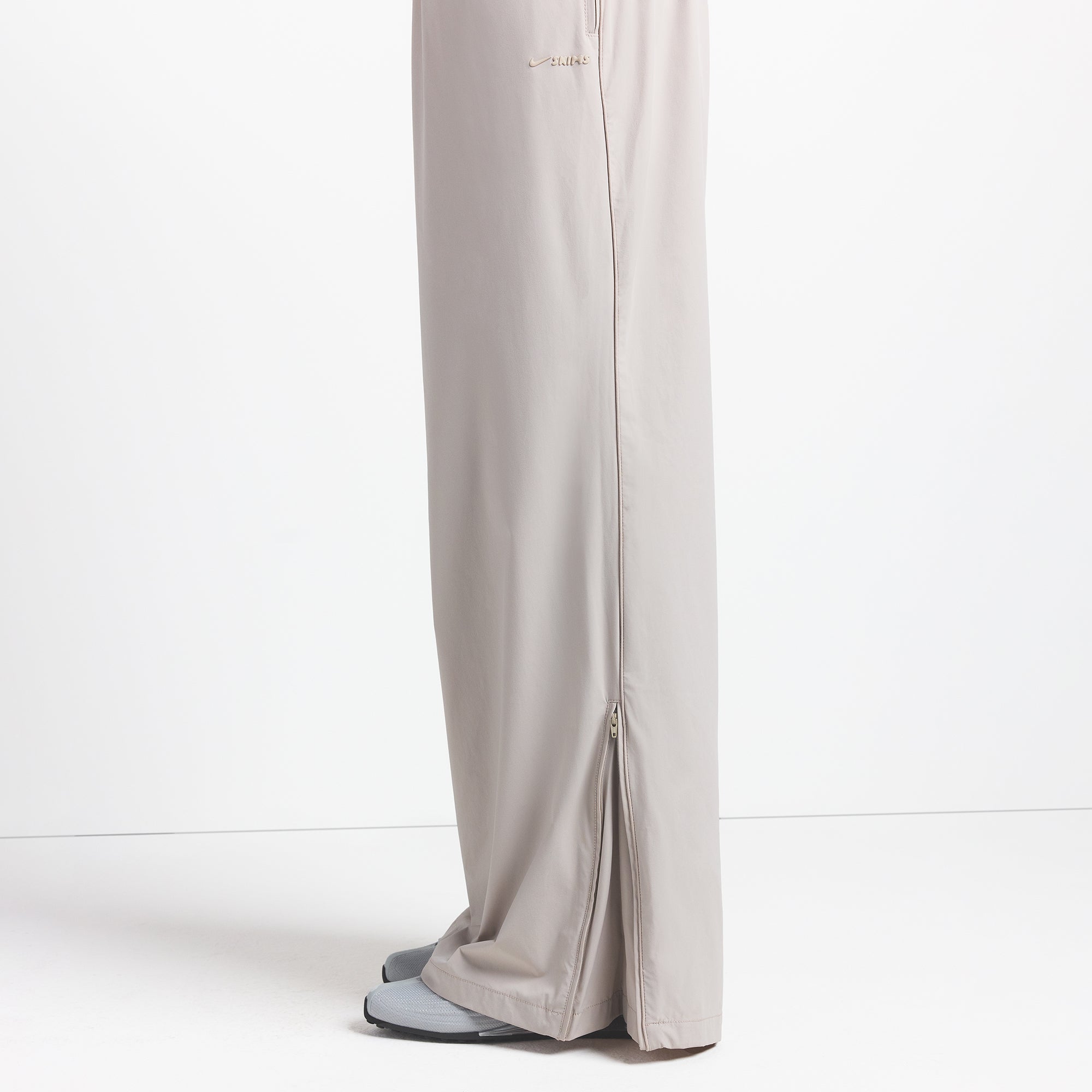 NikeSKIMS WOVEN NYLON OVERSIZED TRACK PANT | STONE