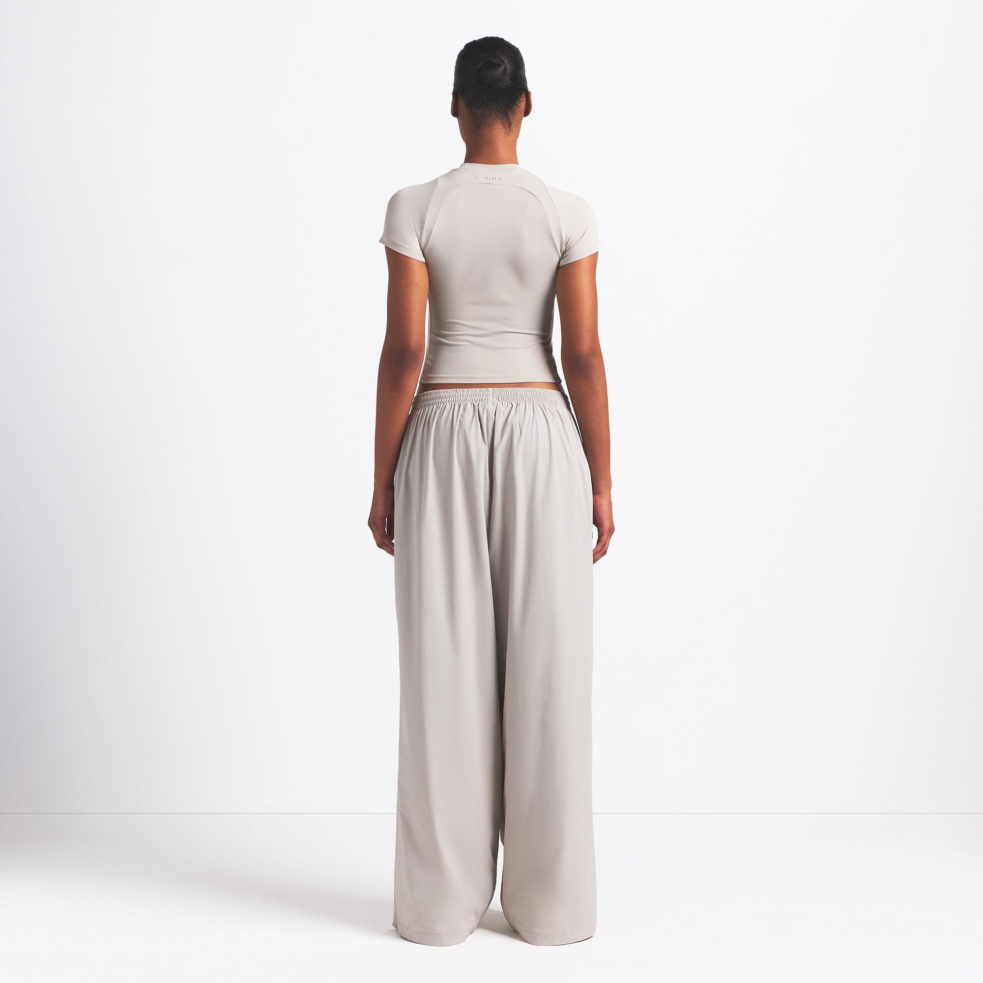 NikeSKIMS WOVEN NYLON OVERSIZED TRACK PANT | STONE