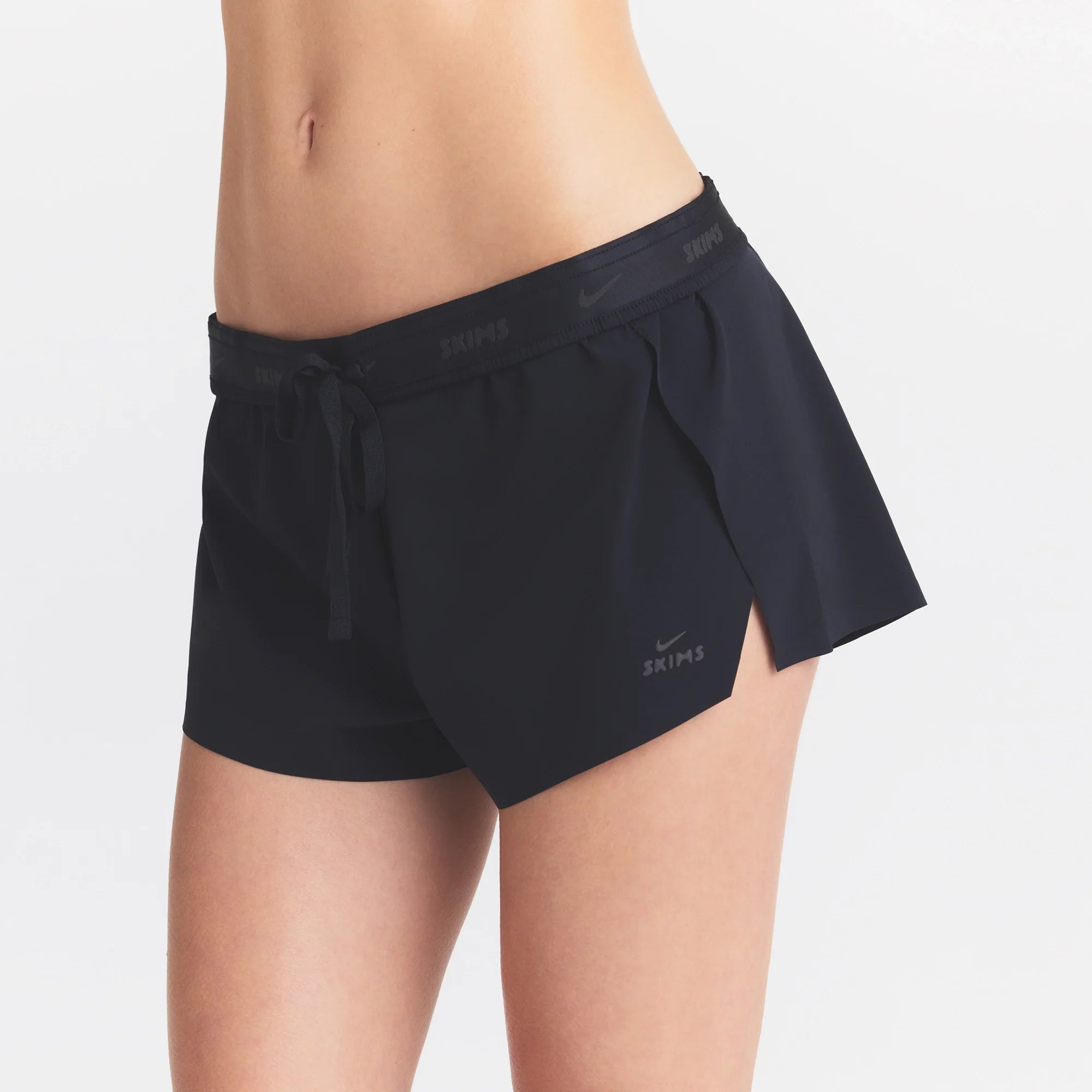 NikeSKIMS STRETCH NYLON RUNNER SHORT | OBSIDIAN
