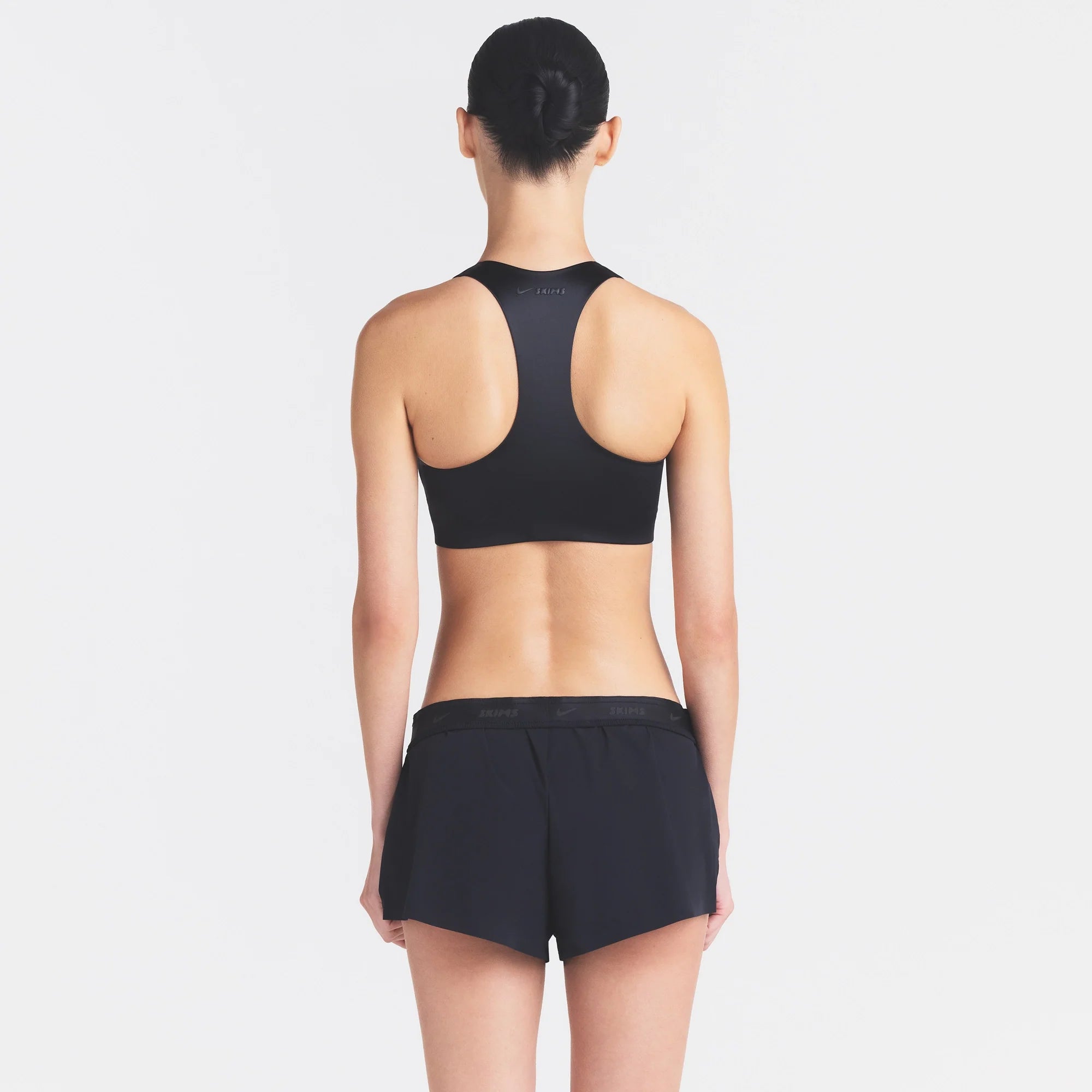 NikeSKIMS STRETCH NYLON RUNNER SHORT | OBSIDIAN