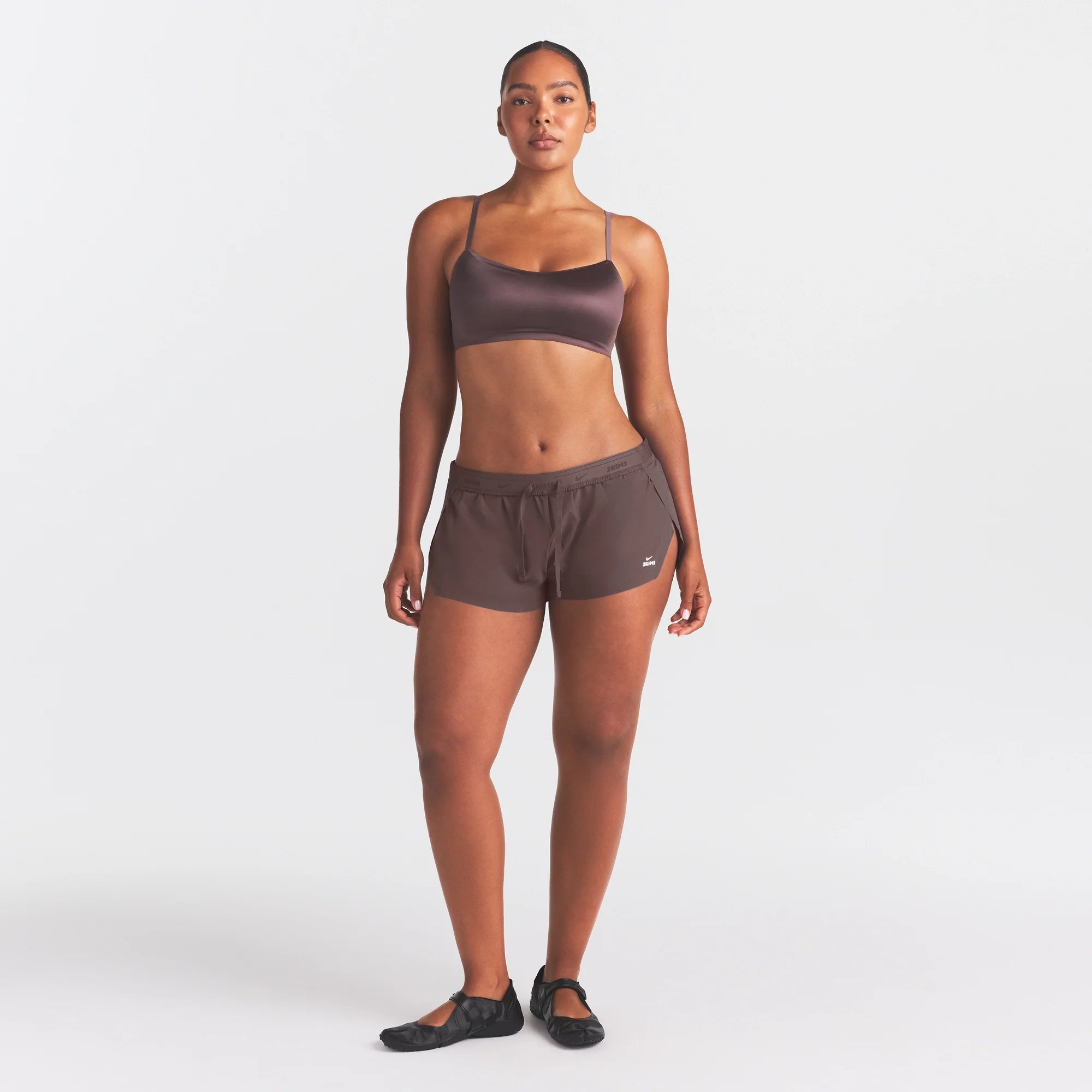 NikeSKIMS STRETCH NYLON RUNNER SHORT | RESIN