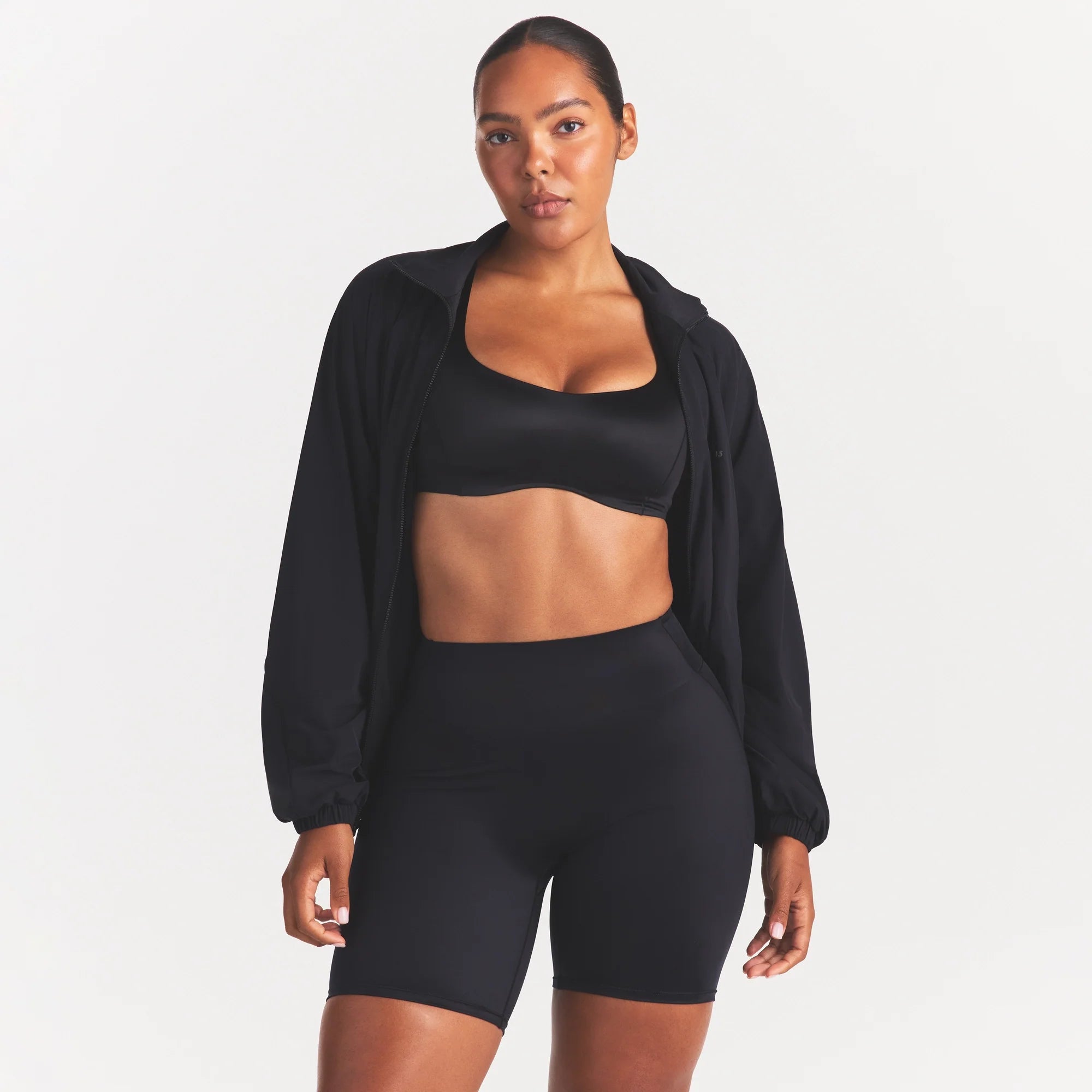 NikeSKIMS STRETCH NYLON OVERSIZED TRACK JACKET | OBSIDIAN