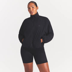 NikeSKIMS STRETCH NYLON OVERSIZED TRACK JACKET | OBSIDIAN
