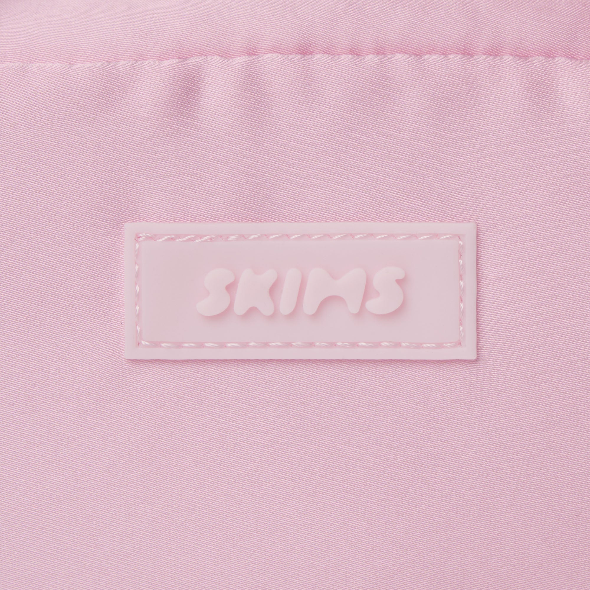 SKIMS ACCESSORIES SATIN MINI DUFFLE BAG | PEONY