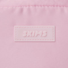 SKIMS ACCESSORIES SATIN MINI DUFFLE BAG | PEONY