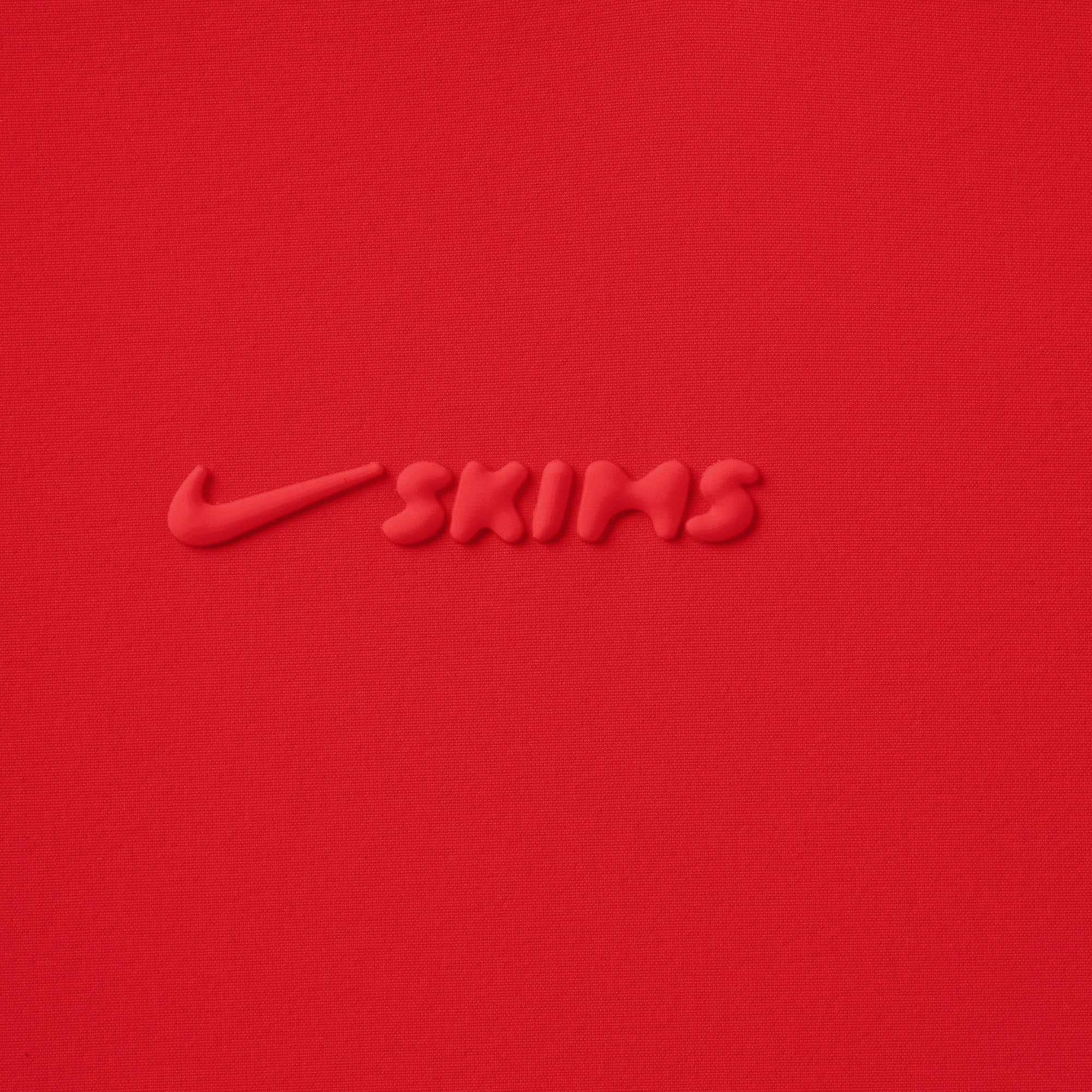 NikeSKIMS WOVEN NYLON 2.5" RUNNER SHORT | RUBY