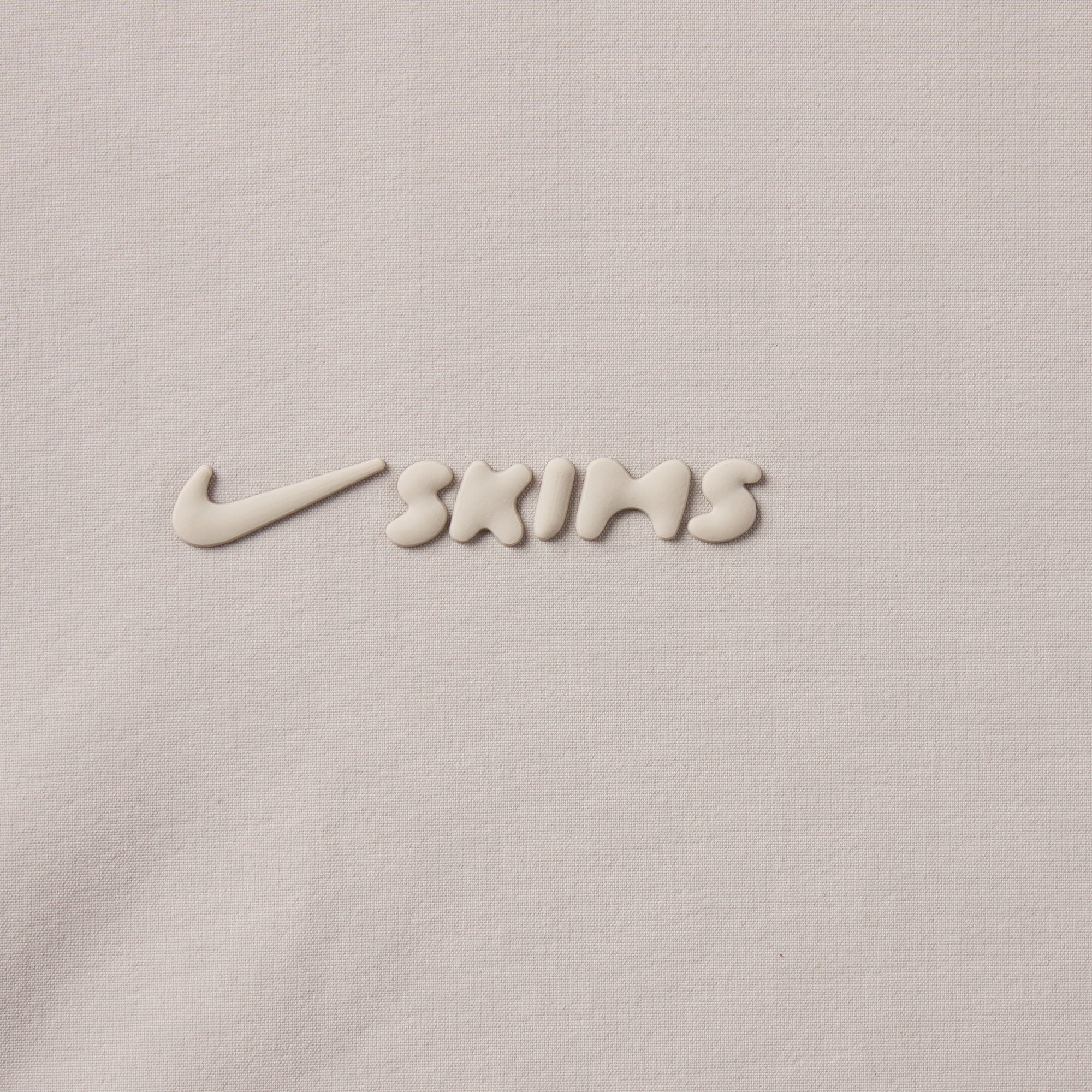 NikeSKIMS WOVEN NYLON 5" TRACK SHORT | STONE