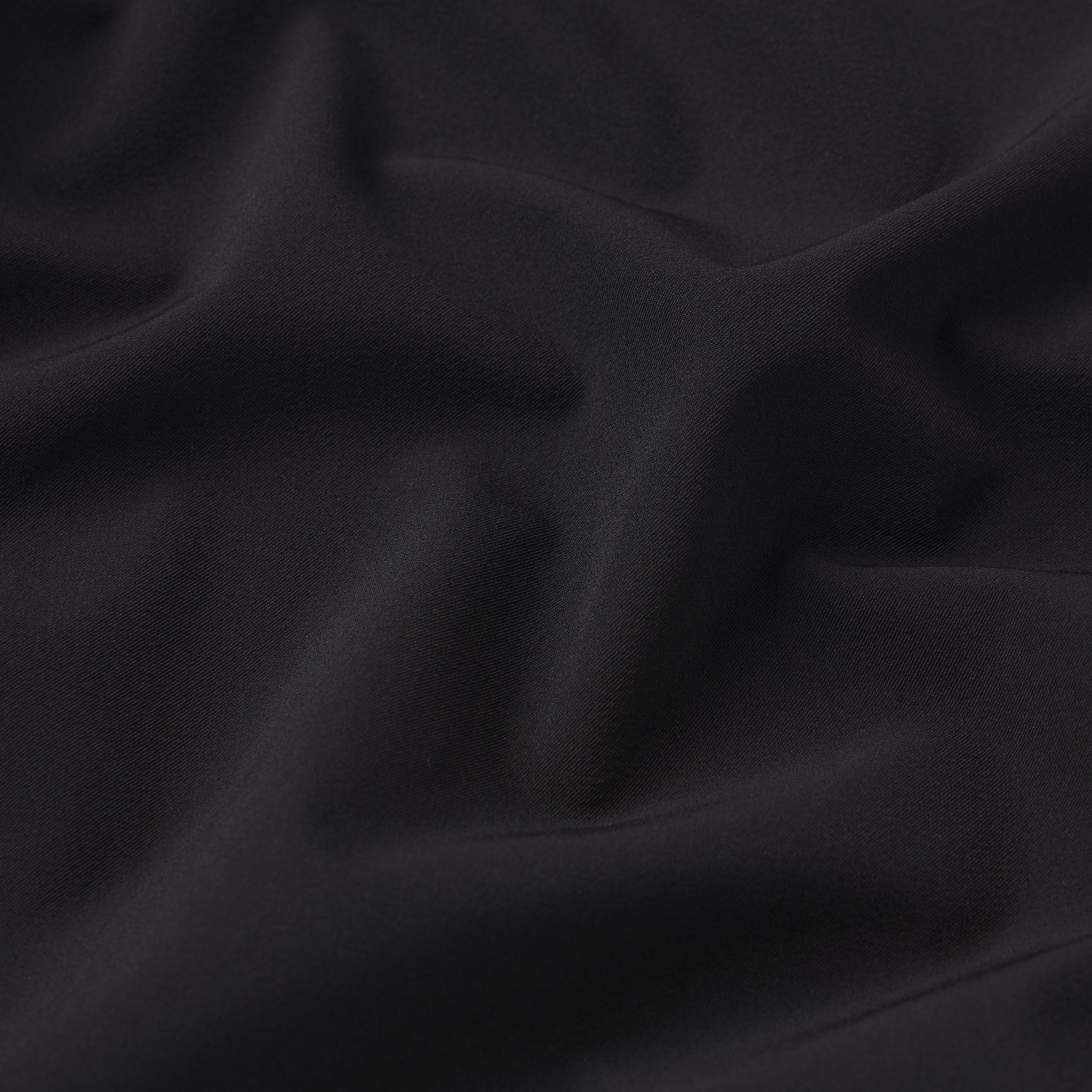 NikeSKIMS STRETCH NYLON OVERSIZED TRACK JACKET | OBSIDIAN